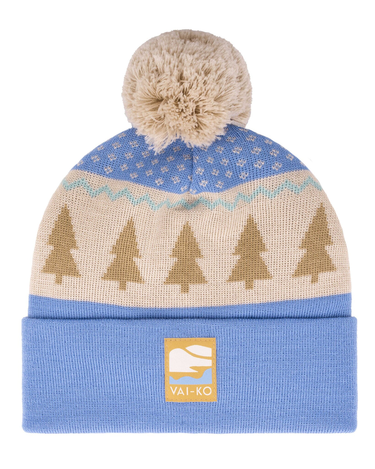 Blue knit beanie with a beige pattern of trees, a pom-pom on top, and a VAI-KO label on the cuff.