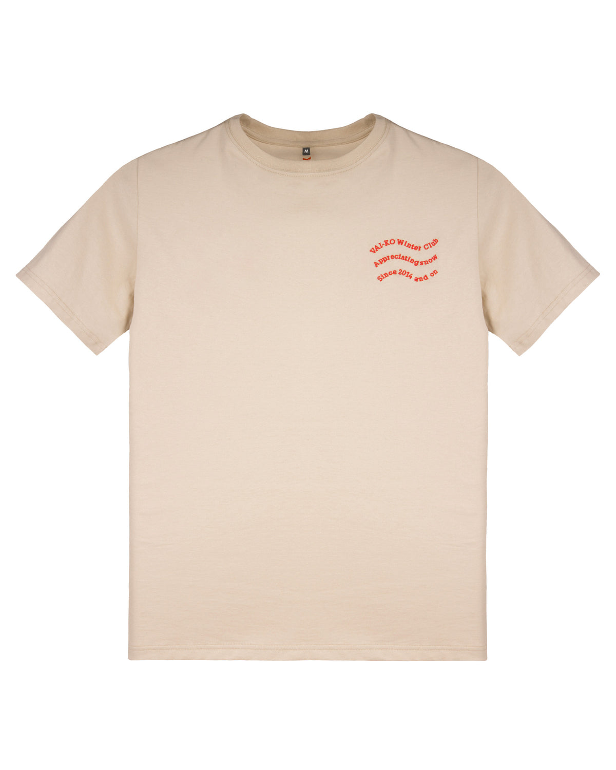 Beige t-shirt with small red text on the left chest, plain background.