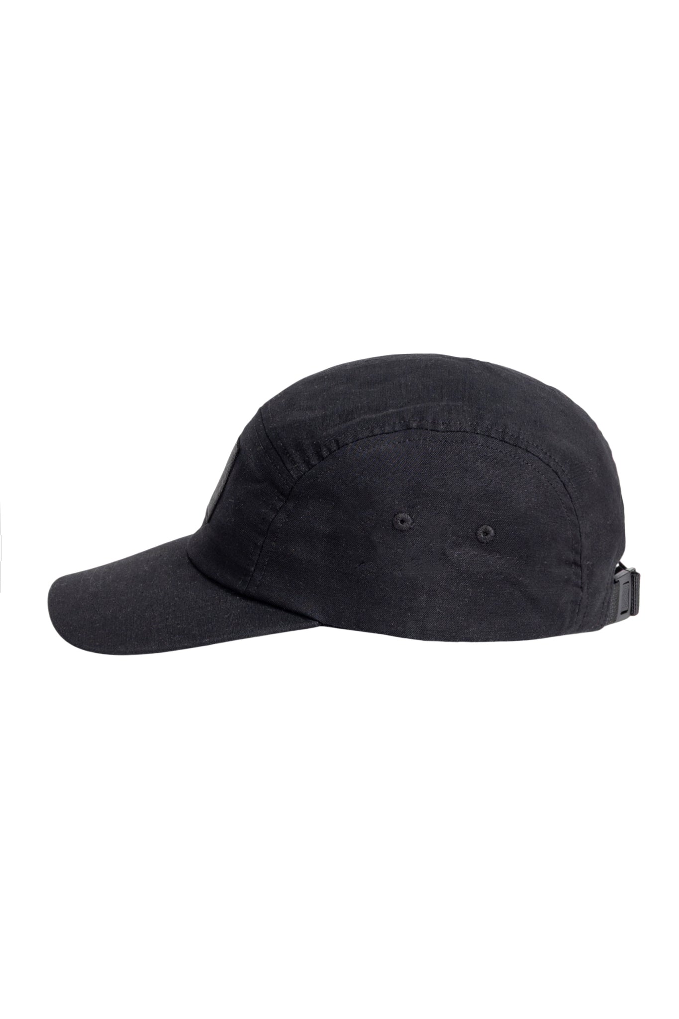 Black baseball cap viewed from the side, featuring a curved brim and an adjustable strap at the back.