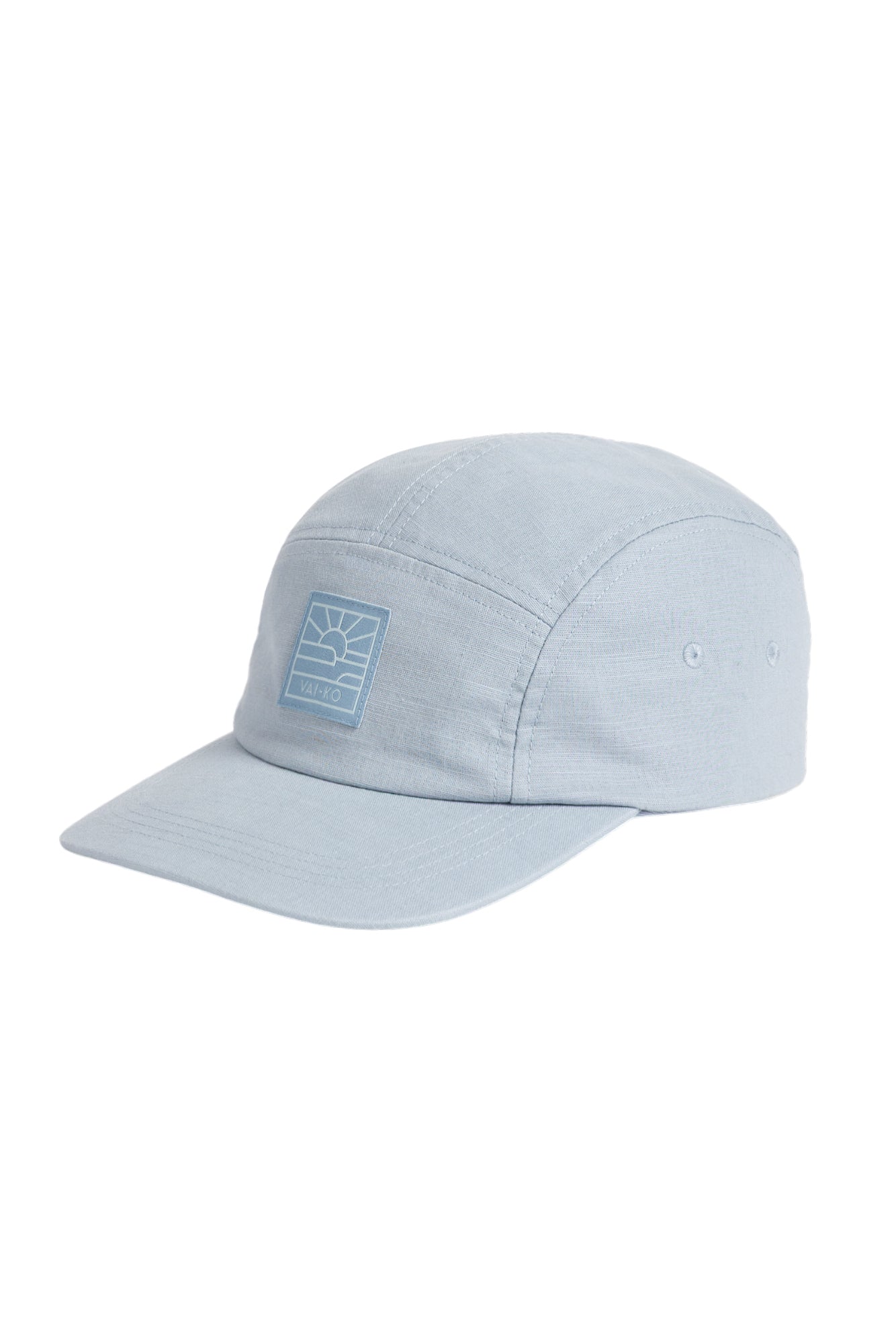 Light blue five-panel cap with a flat brim and a geometric logo patch on the front.