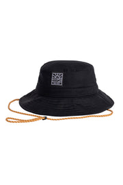 Black bucket hat with a square white logo on the front and an orange adjustable chin strap.
